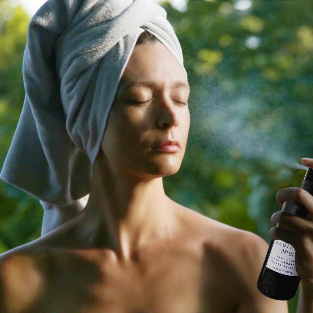 Woman Spraying Vegan Mia Organics Radiance Flower Essence Mist on Her Face